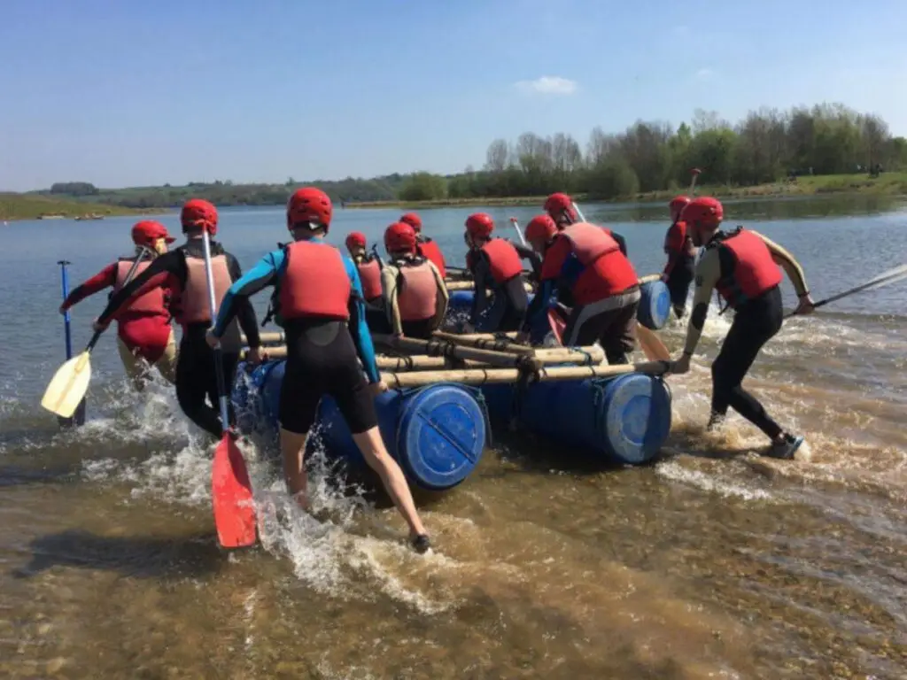 Group Launching a raft in the Peak District